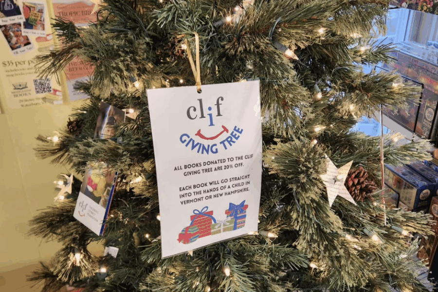 Sign on a Christmas tree promoting the CLiF Giving Tree book donation program.