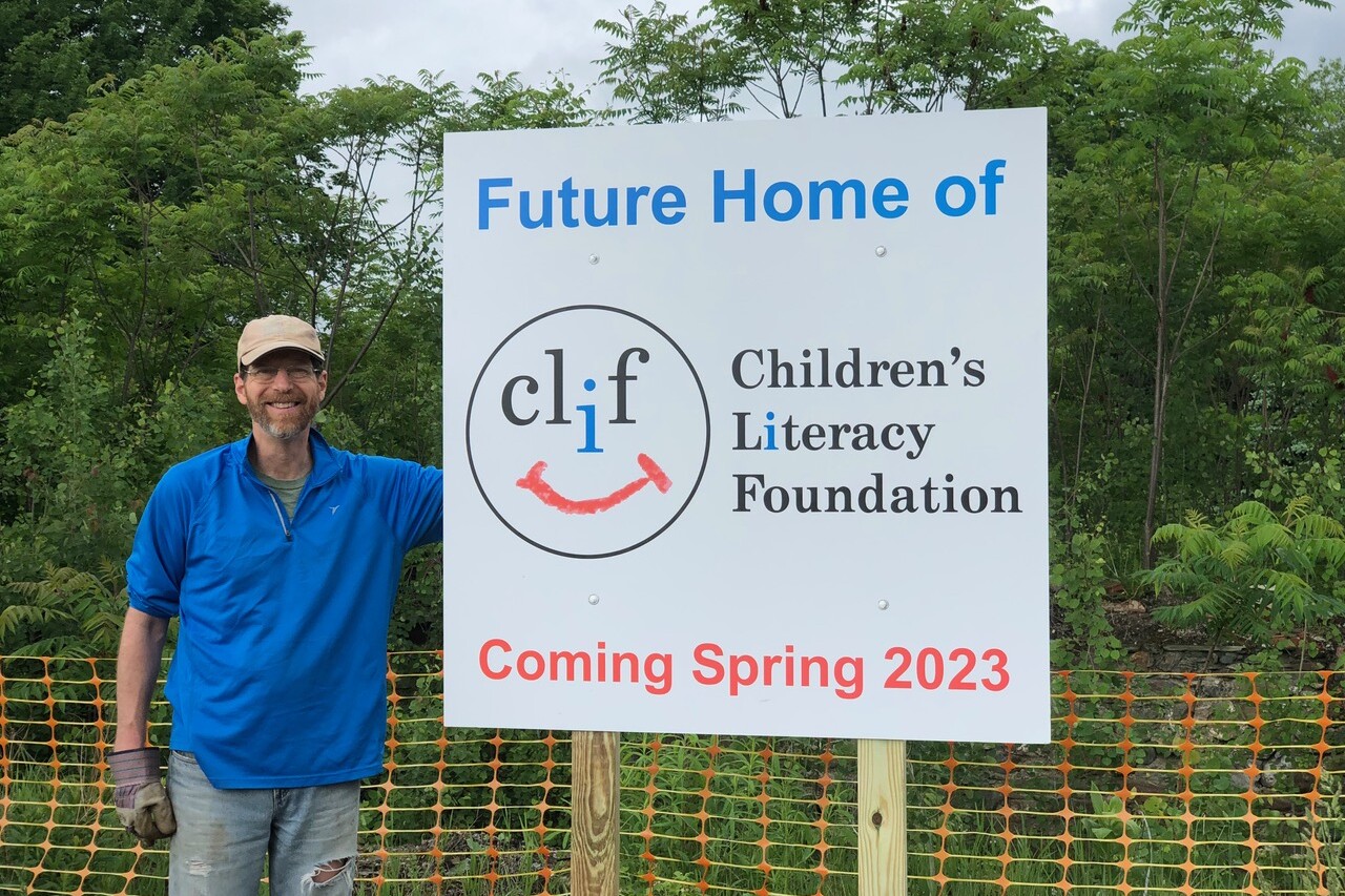 Sign announcing the future home of the Children's Literacy Foundation, coming Spring 2023.
