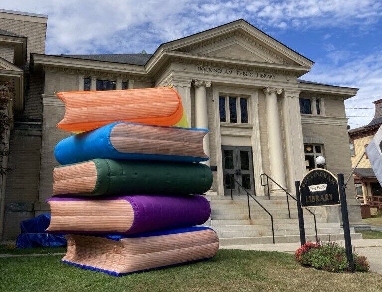 Giant inflatable books sculpture outside Rockingham Free Public Library promoting reading and literacy.